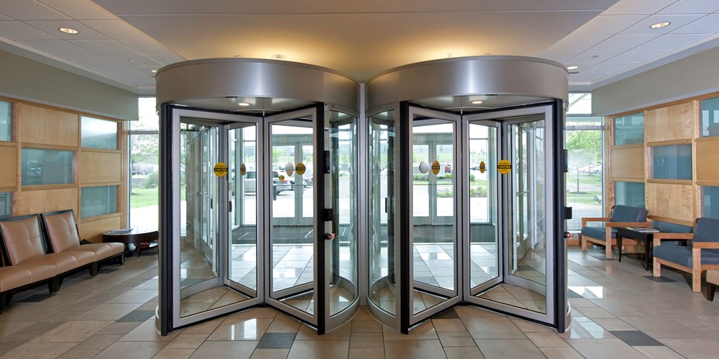 Dual automatic revolving doors entrance and exit